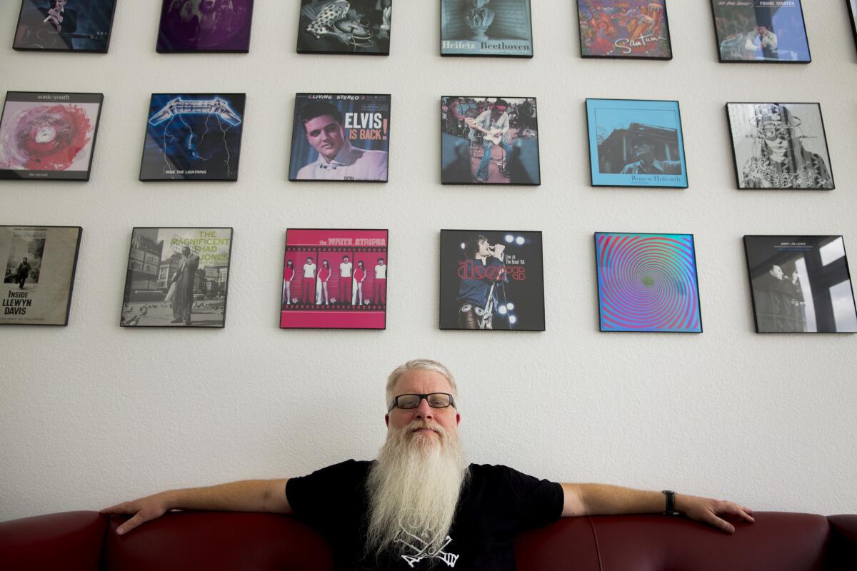 Rob Maushund, with Stoughton Printing Co., is photographed in its lobby.