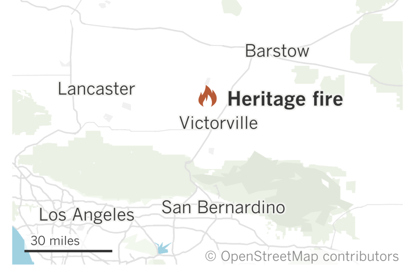 A map shows the location of the Heritage fire burning north of Victorville