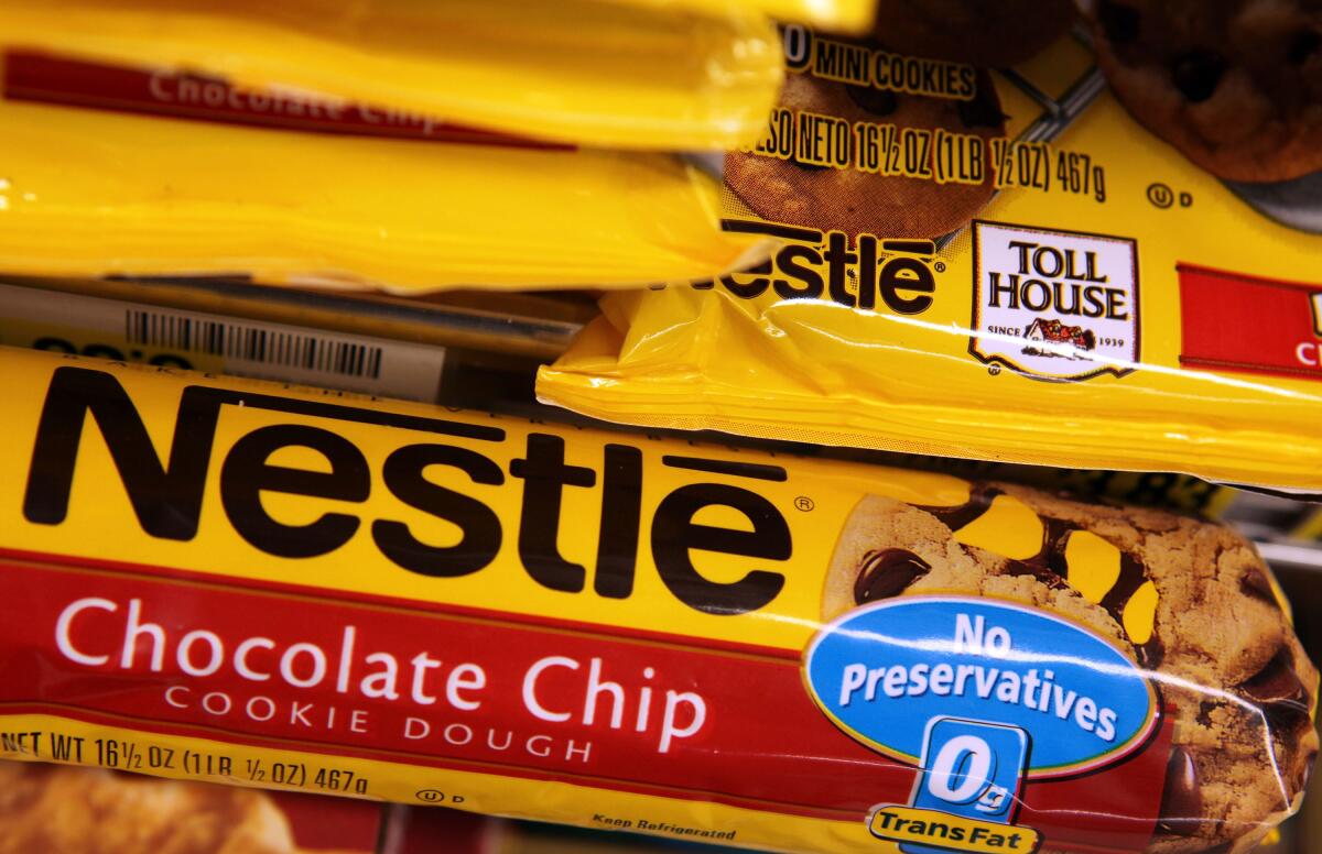 Packages of Nestle Toll House chocolate chip cookies are displayed on a shelf