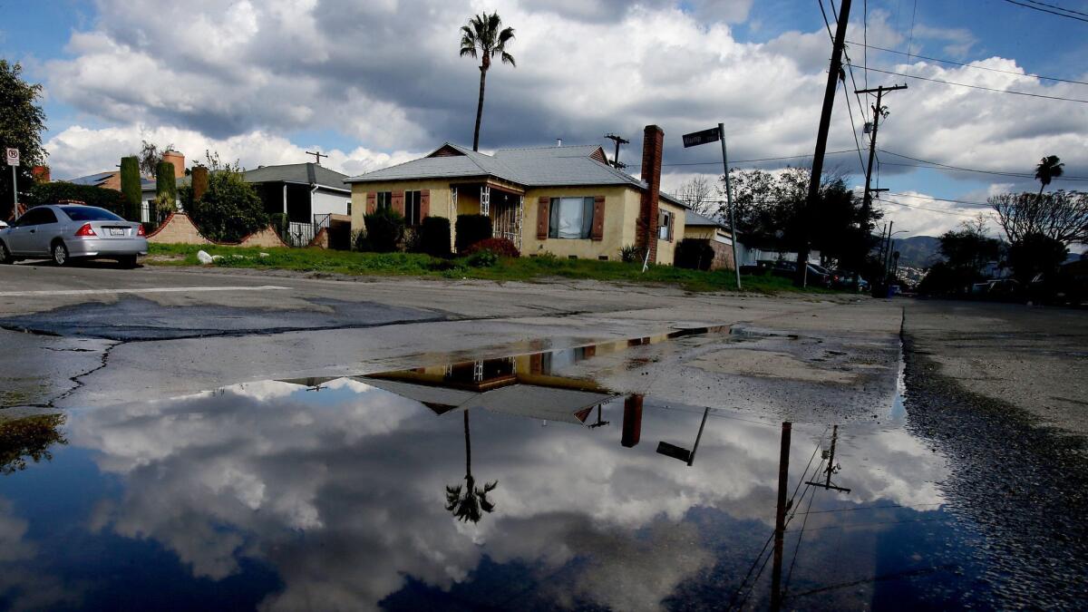 Rain water collects in Sun Valley neighborhood of Los Angeles, an area prone to street flooding in stormy weather, on Jan. 27, 2017.