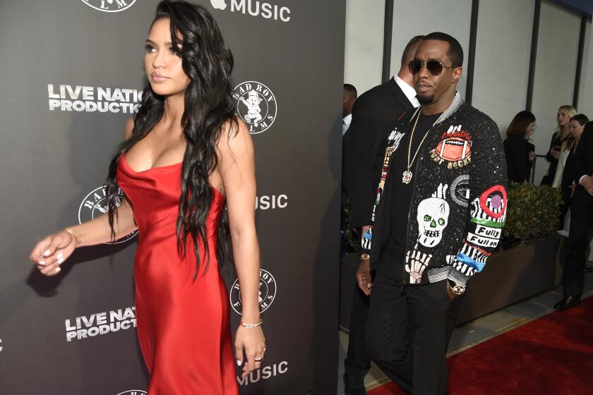 Cassie Ventura, left, and Sean "Diddy" Combs arrive at the Los Angeles premiere of "Can't Stop, Won't Stop: A Bad Boy Story" at the Writers Guild Theater on Wednesday, June 21, 2017, in Beverly Hills, Calif. (Photo by Chris Pizzello/Invision/AP)