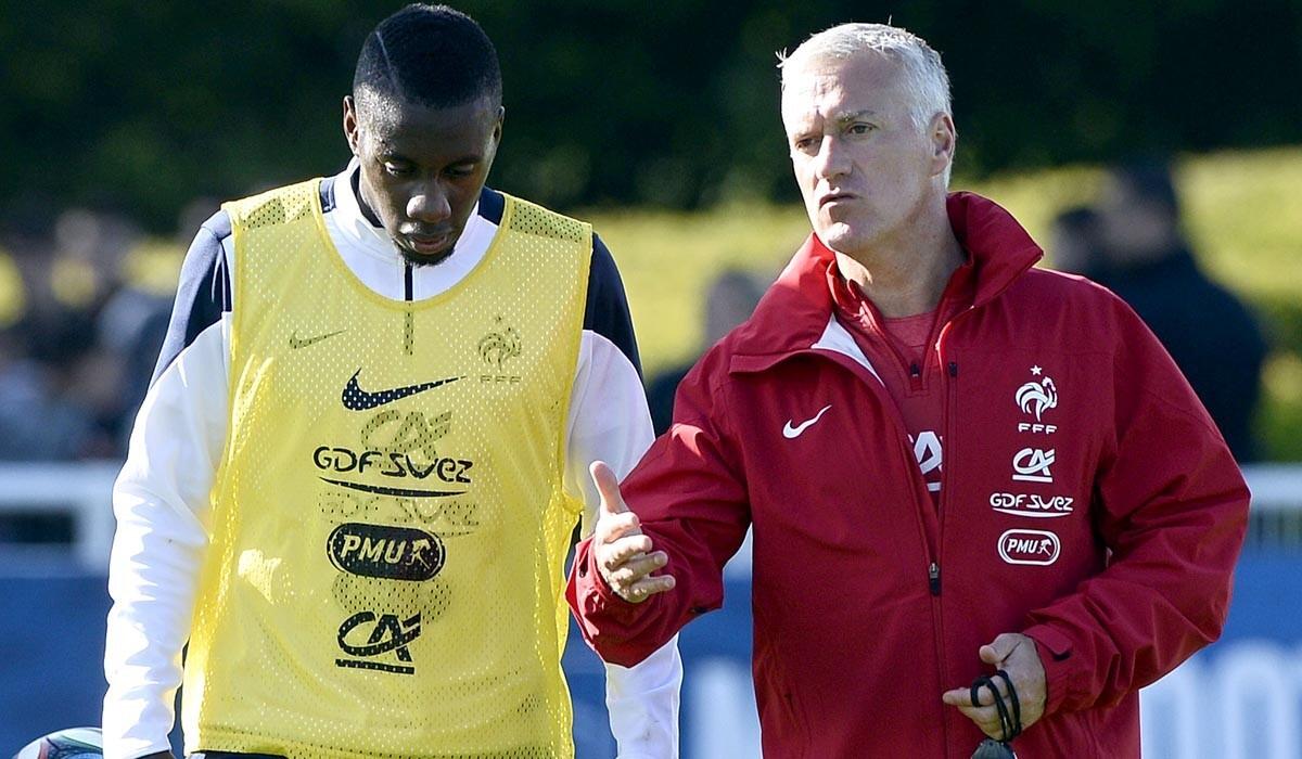 France Coach Didier Deschamps, right, talks to midfielder Blaise Matuidi at the end of a training session.