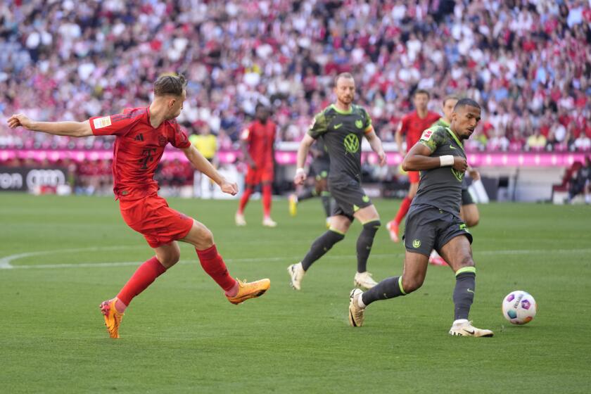 Bayern's Lovro Zvonarek scores his side's opening goal during the German Bundesliga soccer match between Bayern Munich and VfL Wolfsburg at the Allianz Arena in Munich, Germany, Sunday, May 12, 2024. (AP Photo/Matthias Schrader)