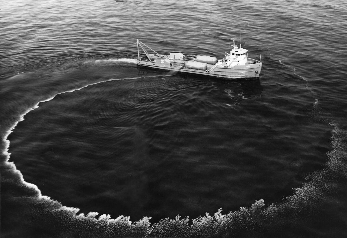 A 140foot workboat sprays chemicals to disperse the slick that coated the coastal waters and eventually stretched 35 miles from Rincon Point, on the Santa BarbaraVentura County line, to Goleta. (Los Angeles Times)