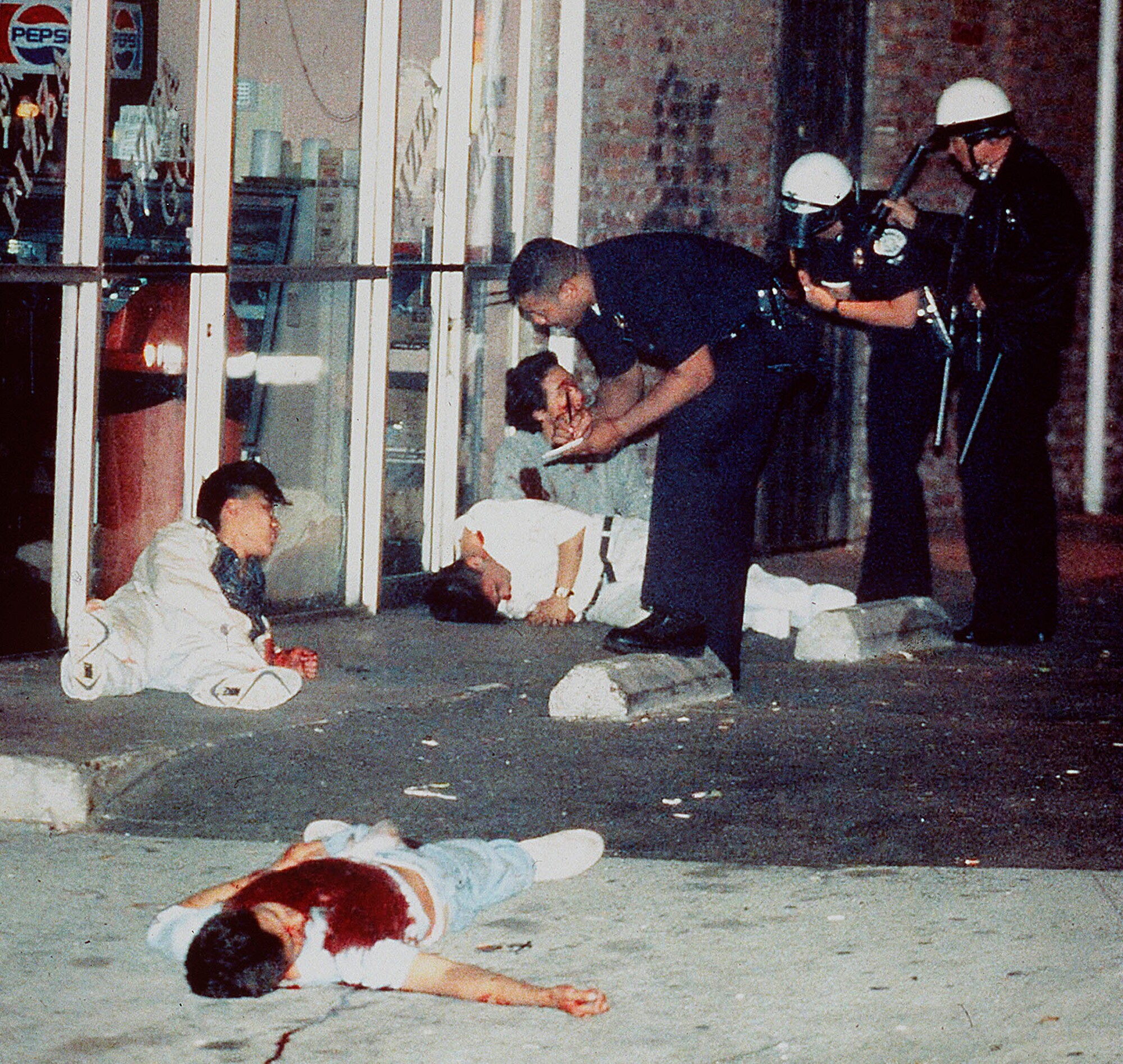 Edward Song Lee, foreground, was shot to death and three other Koreans were injured in Koreatown on April 30, 1992.