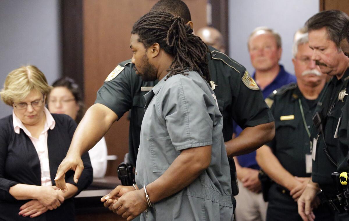 Jesse Leroy Matthew Jr. is escorted into a courtroom in Galveston, Texas, on Sept. 25 for a hearing about extraditing him to Virginia.