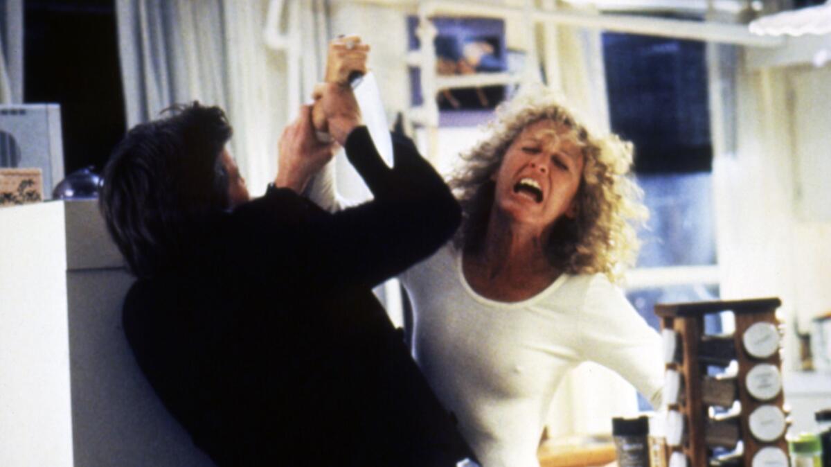 From left to right, Michael Douglas and Glenn Close on the set of "Fatal Attraction" directed by British Adrian Lyne.