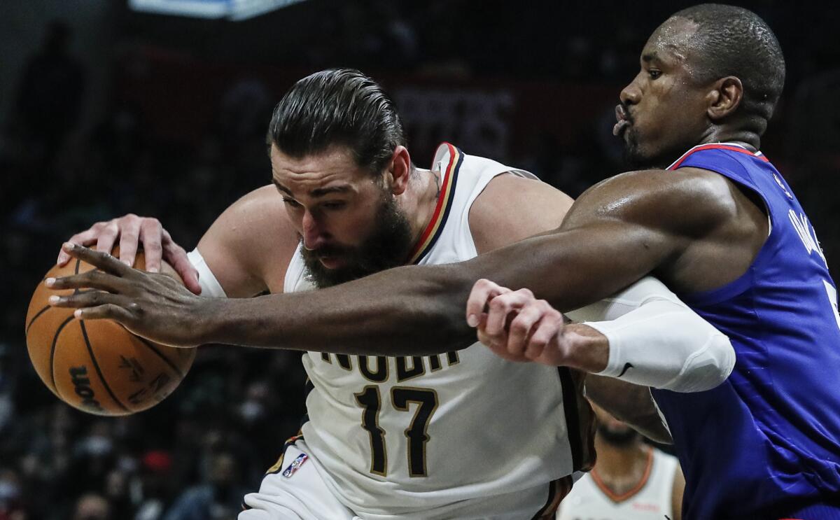 Clippers center Serge Ibaka struggles to cover New Orleans Pelicans center Jonas Valanciunas.