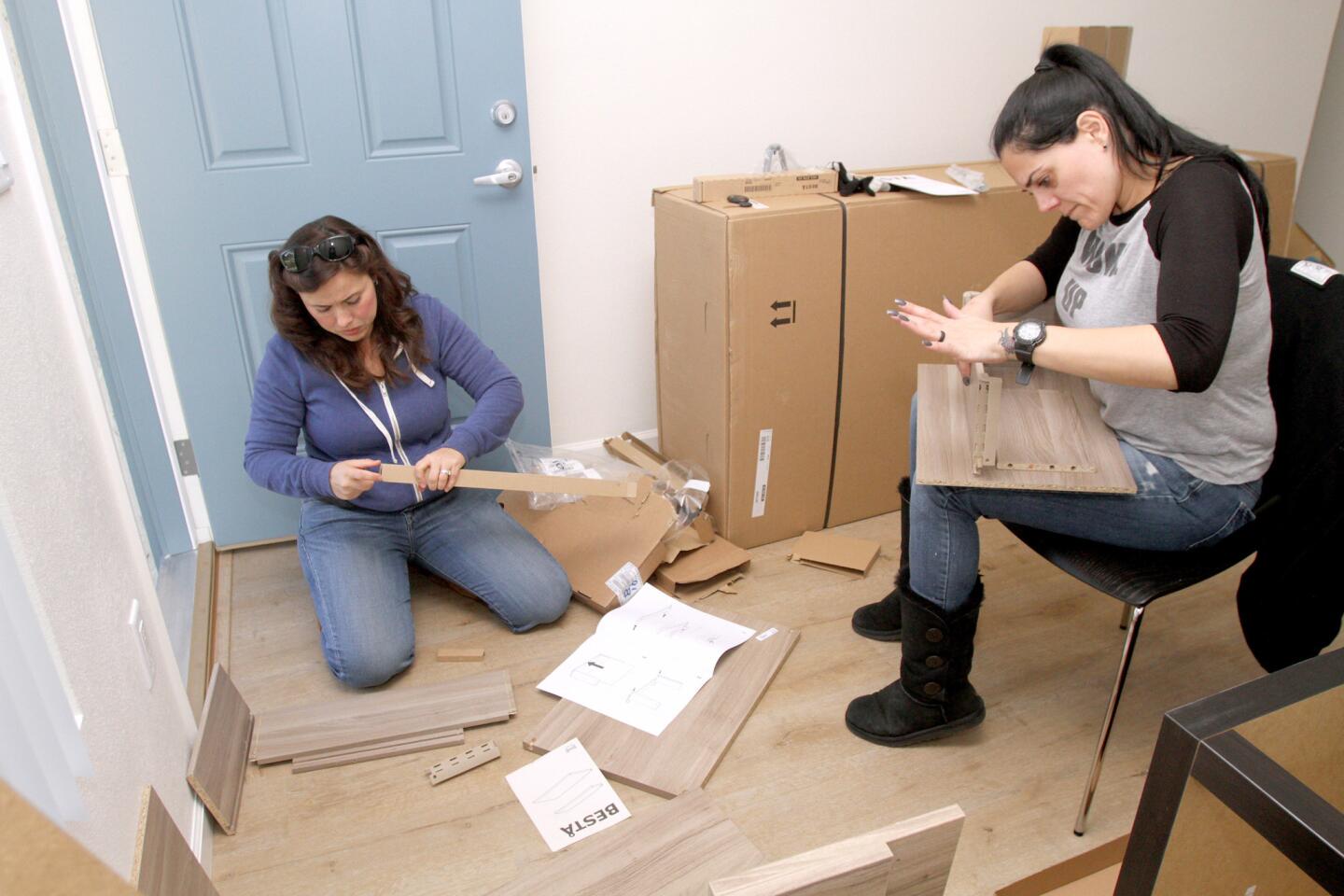 Photo Gallery: Volunteers help build furniture for Veterans' bungalows