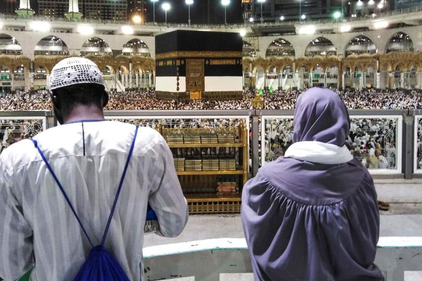 Muslim worshippers watch as others circumambulate around the Kaaba, Islam's holiest shrine, at the Grand Mosque in Saudi Arabia's holy city of Mecca on August 17, 2018 prior to the start of the annual Hajj pilgrimage in the holy city. - Muslims from across the world are gathering in Mecca in Saudi Arabia for the annual hajj pilgrimage, one of the five pillars of Islam. (Photo by AHMAD AL-RUBAYE / AFP)AHMAD AL-RUBAYE/AFP/Getty Images ** OUTS - ELSENT, FPG, CM - OUTS * NM, PH, VA if sourced by CT, LA or MoD **