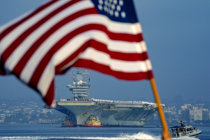 The USS Abraham Lincoln strike group makes her way into San Diego bay