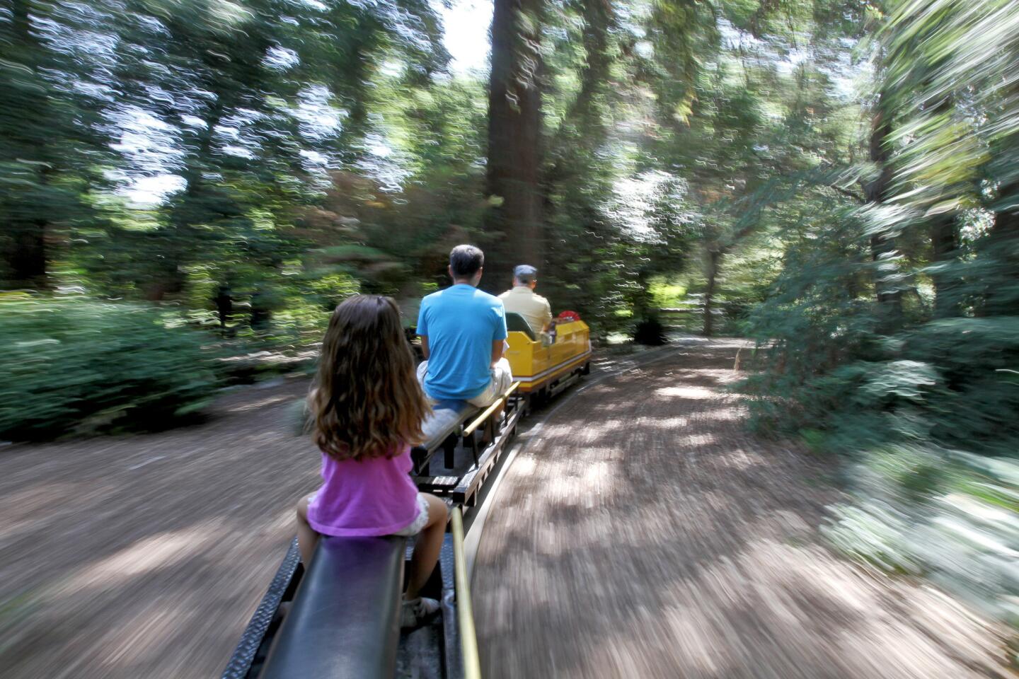 Elizabeth Pittman, 4 and visiting from Ft. Worth Tx., rides the Enchanted Gardens Railroad train on the Fourth of July weekend, at Descanso Gardens in La Cañada Flintridge on Saturday, July 2, 2016. The train rides are not included with admission and require the purchase of an additional ticket.