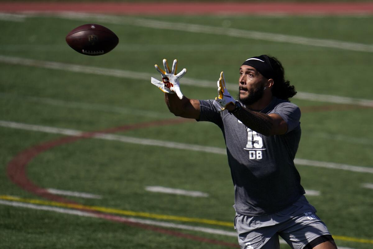 USC safety Talanoa Hufanga catches a pass during the school's pro day workout on March 24.