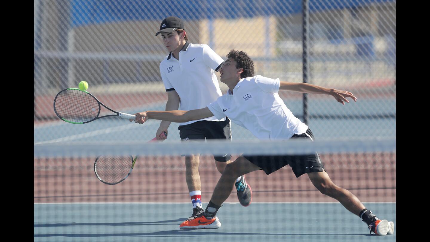 Corona del Mar High No. 1 doubles players John Dick, right, and Bradley Amor compete against Fountain Valley in a Surf League match at Fountain Valley on Tuesday.