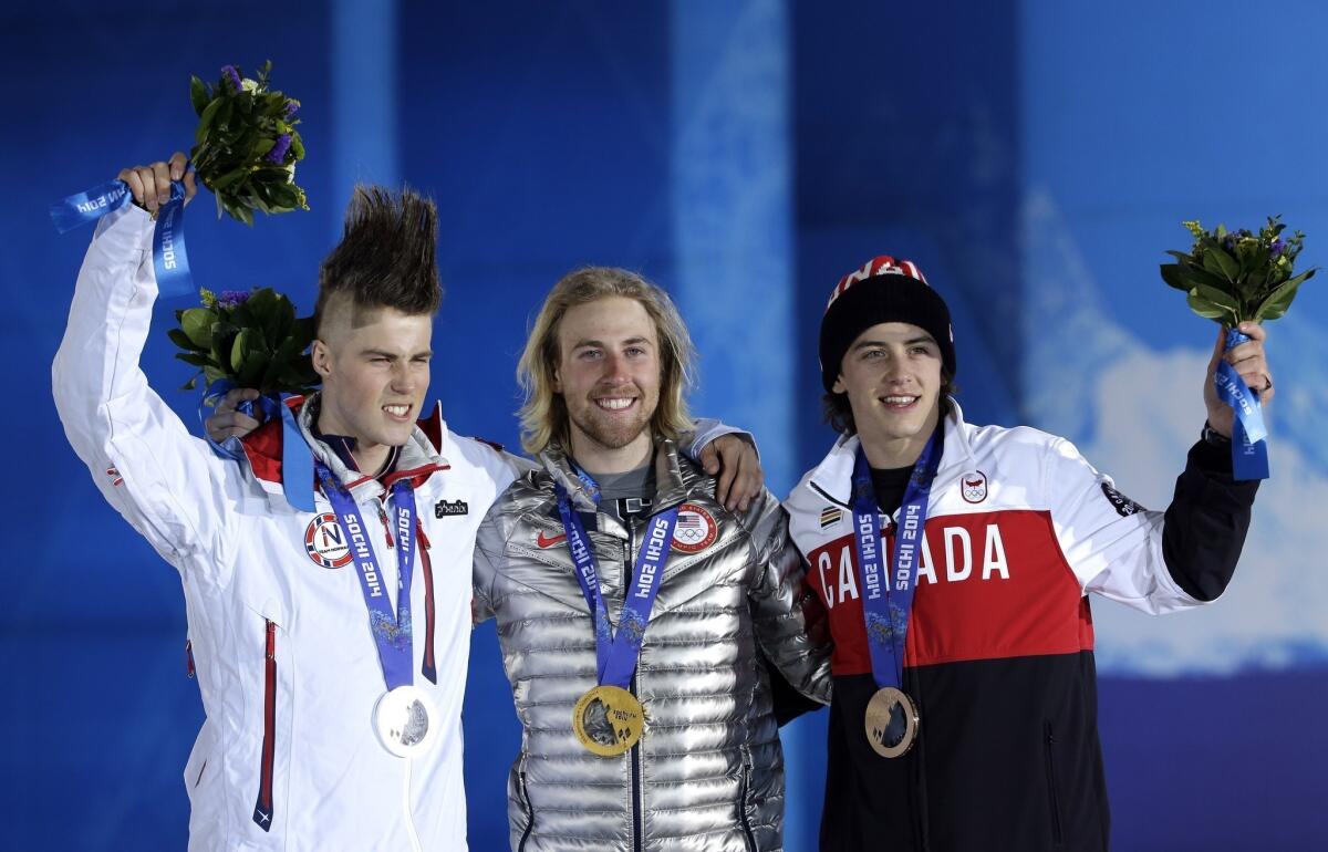 Olympics, meet your new look. Slopestyle gold medalist Sage Kotsenburg of the U.S., center, celebrates on the podium with silver medalist Staale Sandbech, left, of Norway and Mark McMorris of Canada.