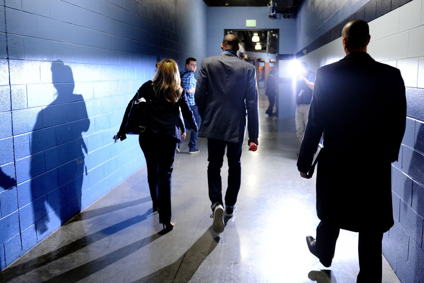 Kobe Bryant, center, leaves FedEx Forum in Memphis, Tenn., for the last time as a Laker after a game against the Grizzlies on Feb. 24, 2016.