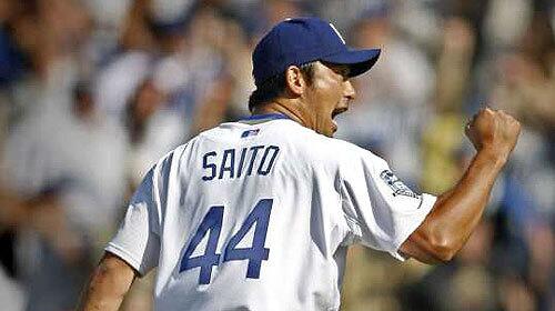 Dodgers closer Takashi Saito celebrates a strikeout in the ninth inning during the Dodgers' 5-0 win over the San Francisco Giants. Saito, working in a non-save situation, retired the Giants in order.