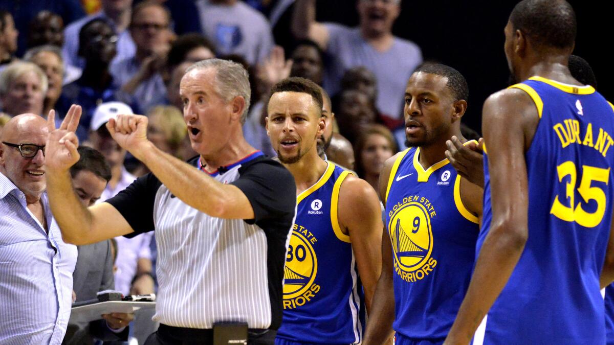 Referee Scott Wall calls a foul on Warriors guard Stephen Curry (30), who would later be ejected along with teammate Kevin Durant.