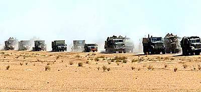 A U.S. military convoy rolls through the Iraqi desert.