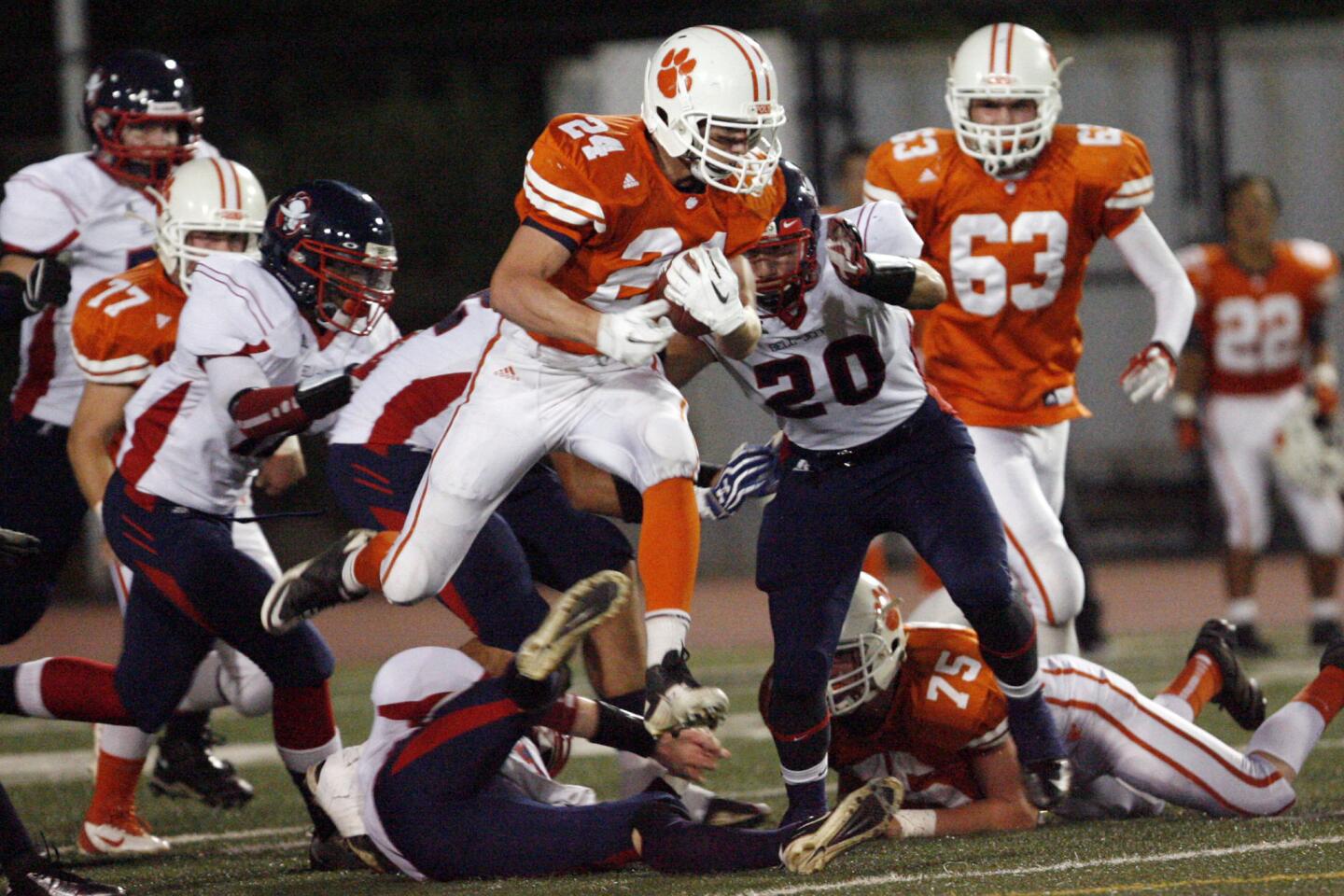 Pasadena Poly's Jake Zelek, center, runs with the ball during a game against Bell-Jeff at South Pasadena High School on Friday, September 28, 2012.