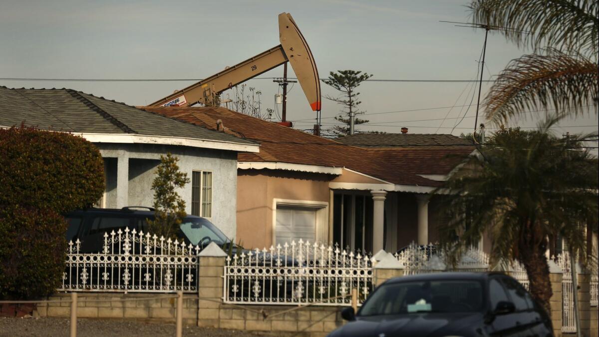 A pump jack pulls oil from the ground in a Wilmington neighborhood in 2016.