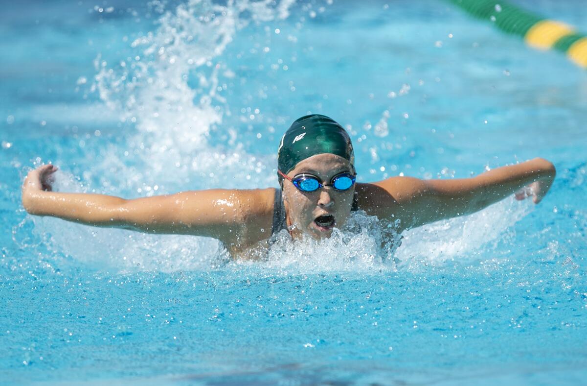 Edison's Gaby Kelly swims the butterfly during the girls' 200 IM during the Wave League swimming finals on Thursday.