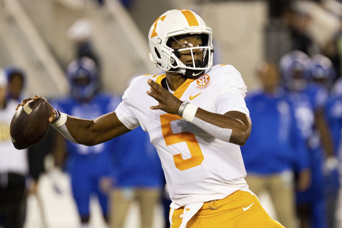 Tennessee quarterback Hendon Hooker (5) throws a pass during the first half of an NCAA college football game against Kentucky in Lexington, Ky., Saturday, Nov. 6, 2021. (AP Photo/Michael Clubb)