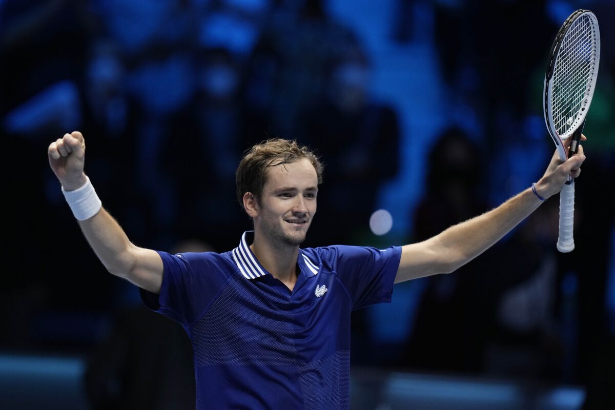 Russia's Daniil Medvedev celebrates after defeating Germany's Alexander Zverev during their ATP World Tour Finals singles tennis match, at the Pala Alpitour in Turin, Tuesday, Nov. 16, 2021. (AP Photo/Luca Bruno)