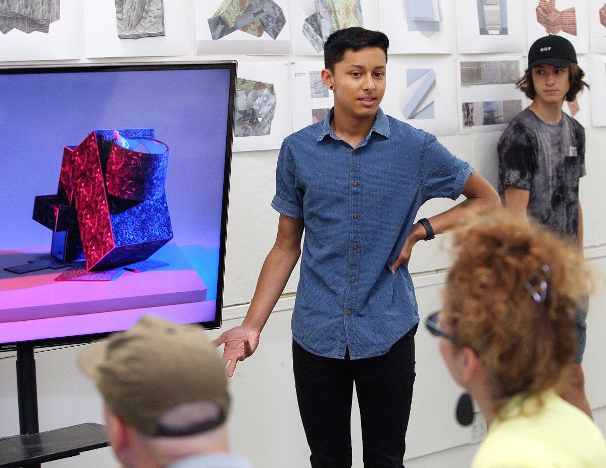 Burroughs High School student Caden Brigstocke answers questions about his designs posed by Dean of Architecture Ingalill Wahlroos-Ritter during his presentation at Woodbury University's seventh annual High School Design Lab Final Reviews in the School of Architecture at Woodbury University on Friday. 'Design Lab' is a five-week program, primarily for low-income students in the LAUSD and Burbank, taught by Woodbury faculty and a graduate student that introduces attendees to principles of design, digital and analog fabrication techniques, and to the world of architecture.