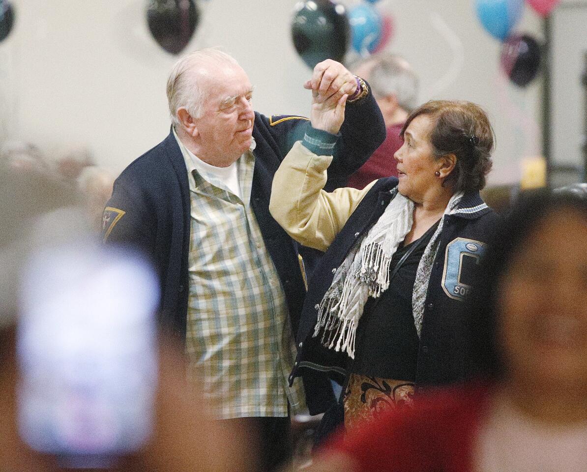 Bob Nicholson, of Glendale, and Emy Quema, of Glendale, dance together at a sock hop, one of several rotating dance opportunities for seniors at the Joslyn Center in Burbank on Monday, January 14, 2019. About 120 people attended the event which had food, a photo booth, and lively dancing.