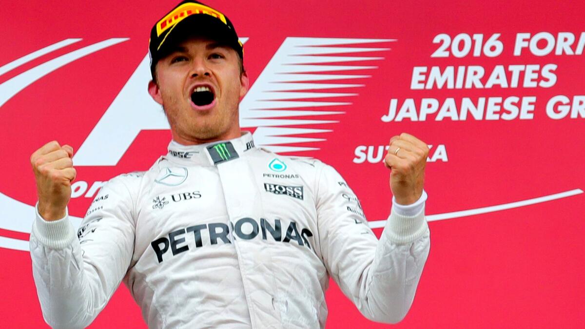 Formula One driver Nico Rosberg celebrates after winning the Japanese Grand Prix on Sunday.