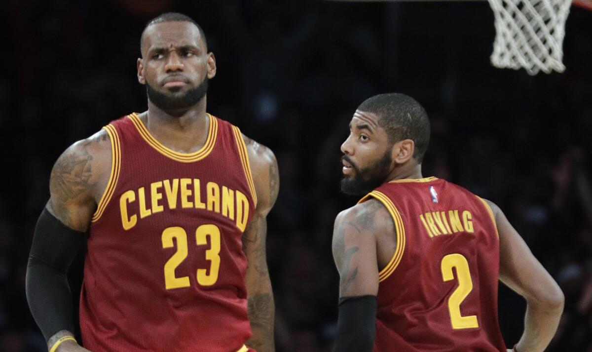 Cleveland Cavaliers' LeBron James, left, and Kyrie Irving play the Los Angeles Lakers in 2016.