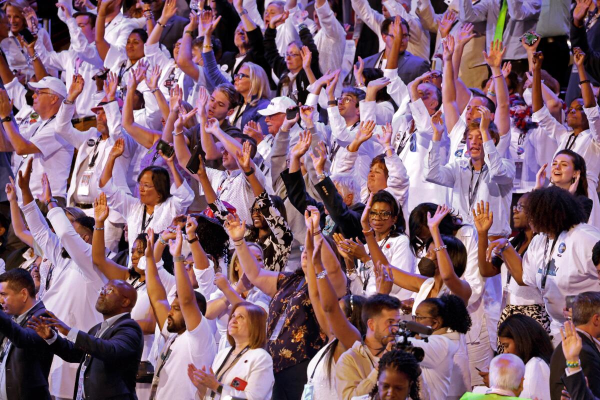 People wear white at the Democratic National Convention Thursday, Aug. 22, 2024, in Chicago, IL.