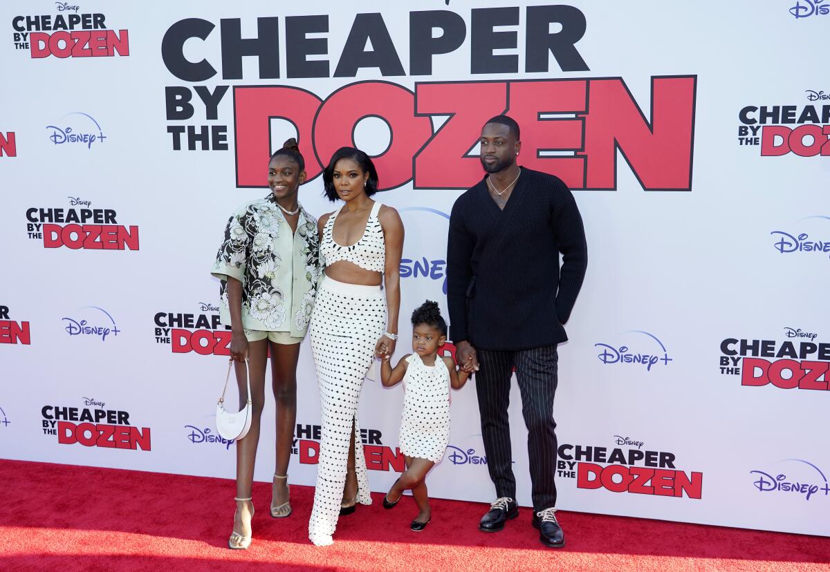 Gabrielle Union poses with her husband Dwyane Wade, Wade's daughter Zaya, their daughter Kaavia James