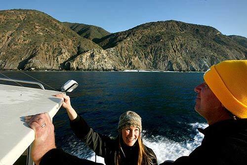 Sara Sikich, coastal resources director for Heal the Bay, and Matthew King, also from Heal the Bay, show where marine life protected areas are being considered in the waters off Catalina Island. Some fishermen are worried about how they will be affected if the areas are declared marine reserves.
