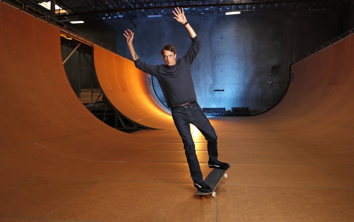 Skateboarding legend Tony Hawk stands on the ramp of his warehouse on Aug. 31, 2020, in Vista, Calif. 