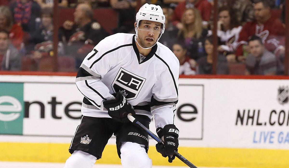 Kings defenseman Alec Martinez brings the puck up ice against the Coyotes earlier this season. He's out recovering from finger surgery.