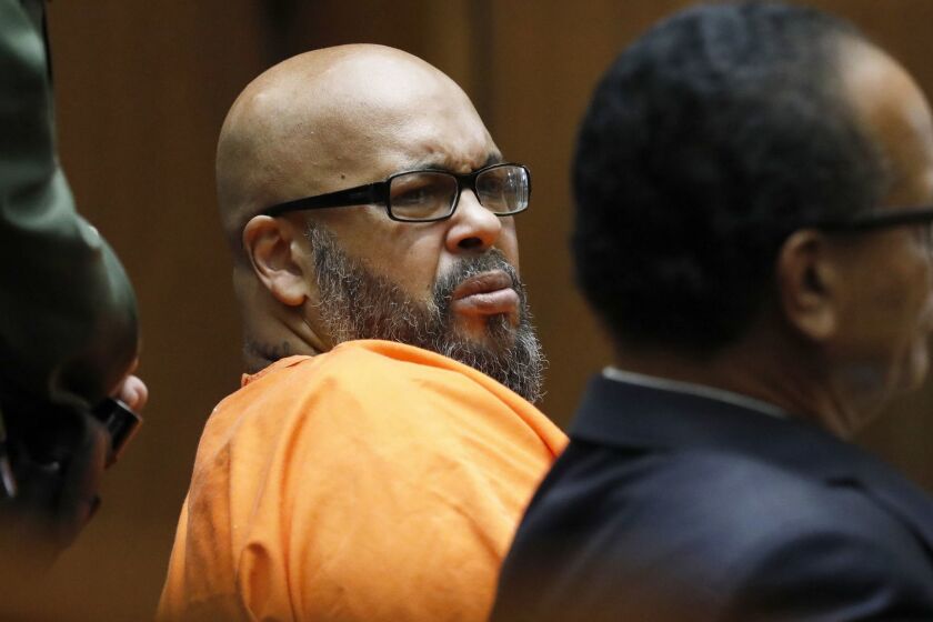 Former rap mogul Marion "Suge" Knight, left, with his defense attorney Albert DeBlanc Jr., listens to the terms of his plea of no contest to voluntary manslaughter Thursday, Sept. 20, 2018, after he ran over two men, killing one, nearly four years ago, in Los Angeles Superior Court Thursday, Sept. 20, 2018. The Death Row Records co-founder has agreed to serve 28 years in prison. (Gary Coronado/Los Angeles Times via AP, Pool)