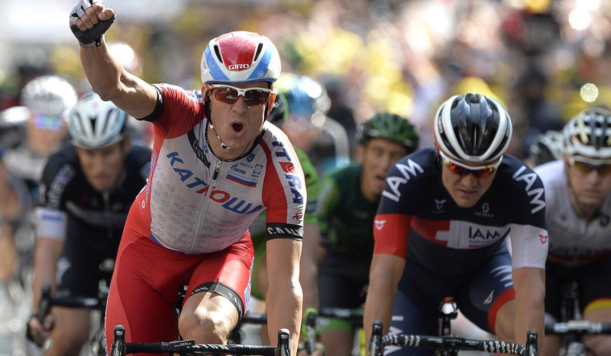 Alexander Kristoff of Norway celebrates as he crosses the finish line to win the 15th stage of the Tour de France on Sunday in Nimes, France.