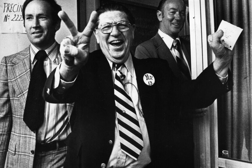 Howard Jarvis, chief sponsor of the controversial Proposition 13, signals victory as he casts his own vote at the Fairfax-Melrose precinct. June 6, 1978 photo by Ben Olender/Los Angeles Times. For From The Archives.