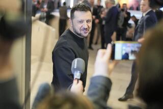 Ukrainian President Volodymyr Zelenskyy talks to reporters after a meeting at the Annual Meeting of World Economic Forum in Davos, Switzerland, Tuesday, Jan. 16, 2024. The annual meeting of the World Economic Forum is taking place in Davos from Jan. 15 until Jan. 19, 2024.(AP Photo/Markus Schreiber)