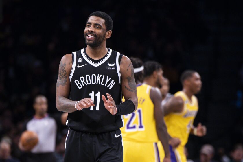 Brooklyn Nets guard Kyrie Irving (11) reacts during the second half of an NBA basketball game against the Los Angeles Lakers, Monday, Jan. 30, 2023, in New York. (AP Photo/Corey Sipkin)