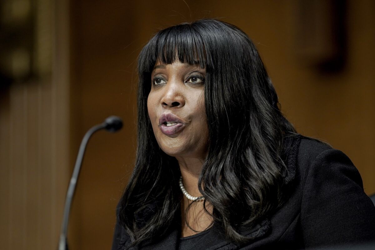 FILE - Lisa Cook, nominee to be a member of the Federal Reserve Board of Governors, speaks during the Senate Banking, Housing and Urban Affairs Committee confirmation hearing on Thursday, Feb. 3, 2022, in Washington. On Tuesday, May 10, 2022, the Senate confirmed economist Cook to serve on the Federal Reserve's board of governors, making her the first Black woman to do so in the institution's 108-year history. (Ken Cedeno/Pool Photo via AP, File)