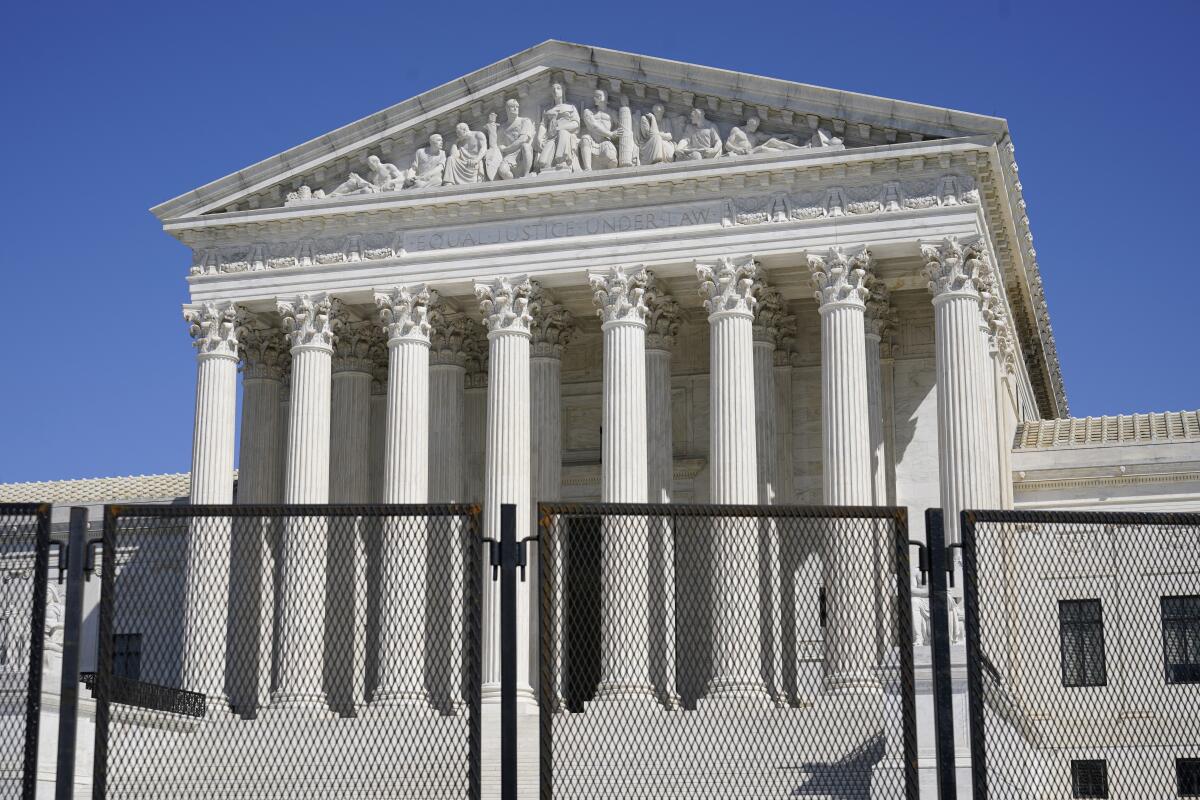 Fencing surrounds the Supreme Court building on March 21
