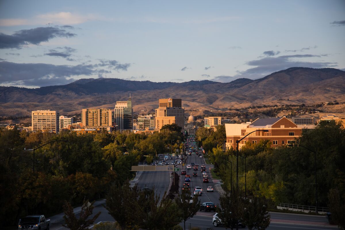 A view of downtown Boise, Idaho's capital, against a backdrop of hills.