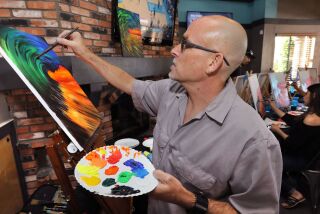 January 20, 2018_San Marcos, California_USA_| Artist Al Scholl works on his painting of a colorful wave as he teaches his Art Therapy class at the Inland Tavern. |_Photo Credit: Photo by Charlie Neuman