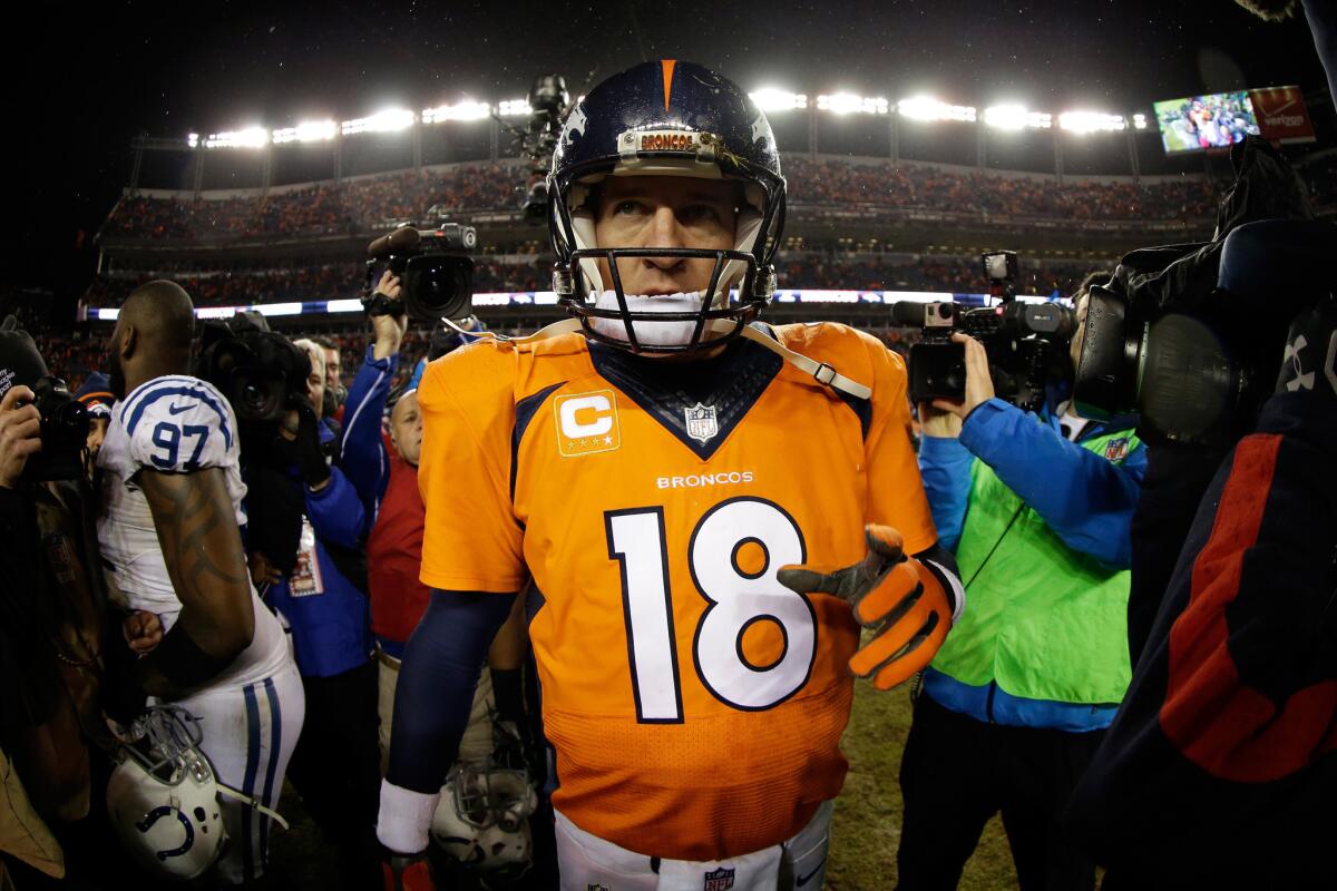 Broncos quarterback Peyton Manning walks off the field in Denver after a 24-13 loss to the Indianapolis Colts in the AFC divisional round of the playoffs on Jan. 11.