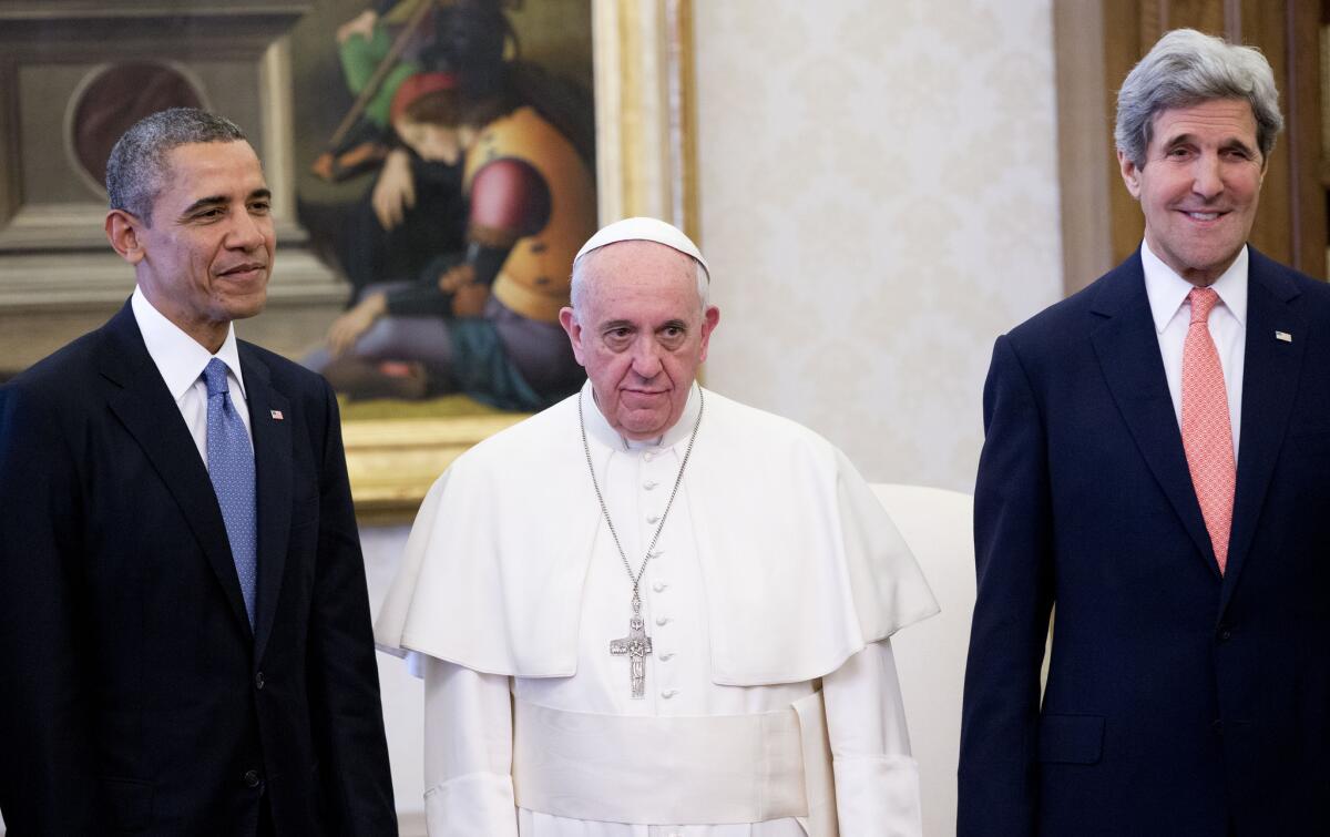 Pope Francis poses with President Obama and Secretary of State John F. Kerry at the Vatican.