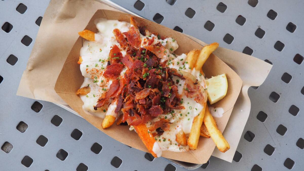 Chowder fries (French fries topped with clam chowder and bacon) from Slapfish in Huntington Beach.