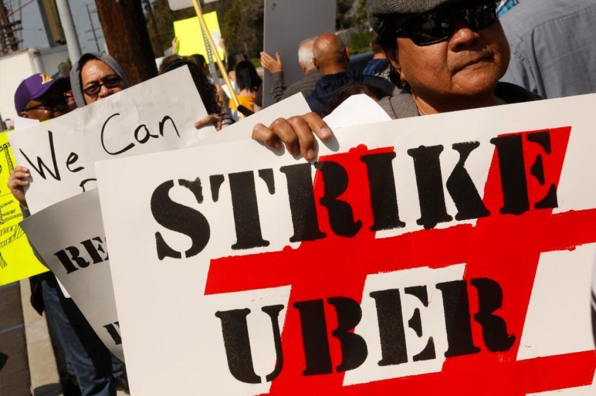 Ride-share drivers picket as part of a 25-hour strike in May in Redondo Beach